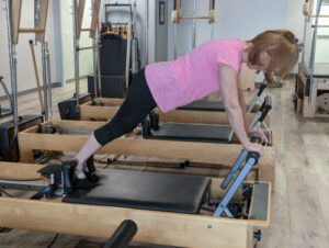 Woman practicing spine-safe Pilates in Sugar Land TX
